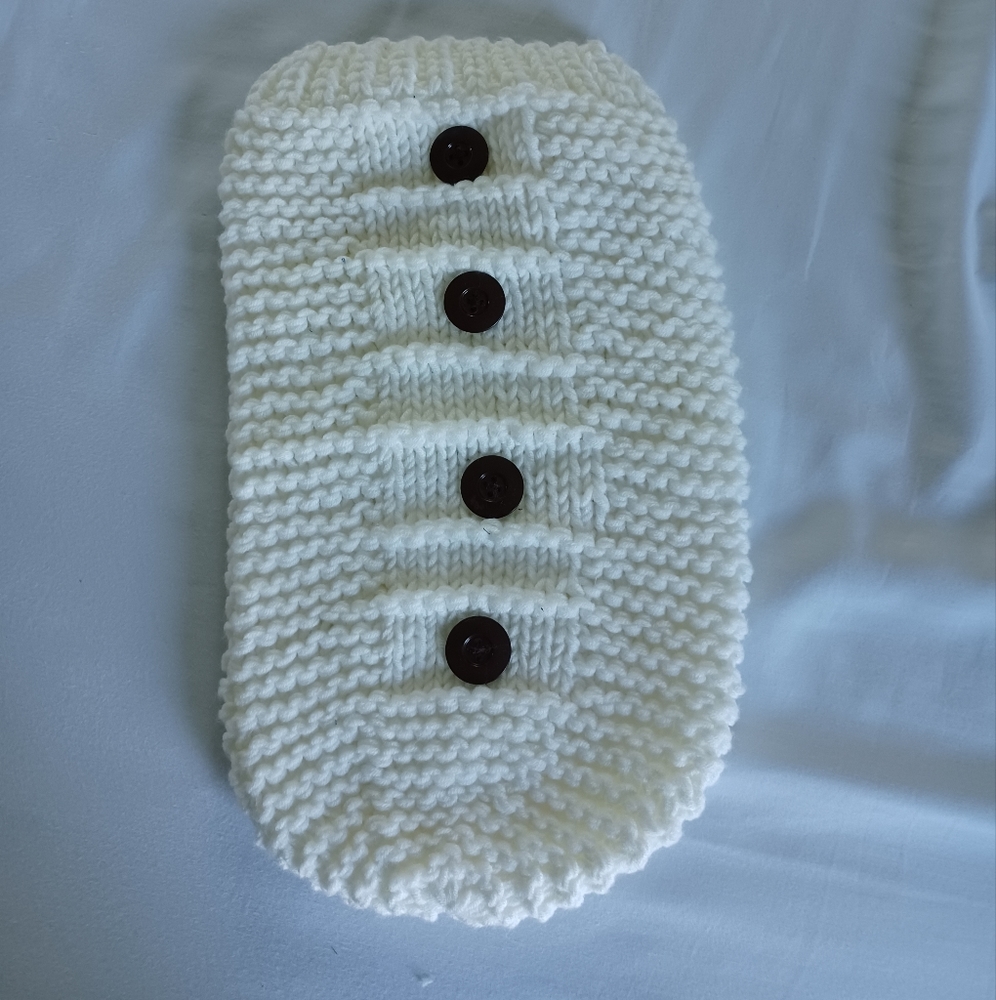 White crocheted newborn cocoon outfit.